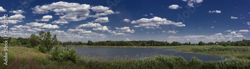 Panorama with lake and clouds