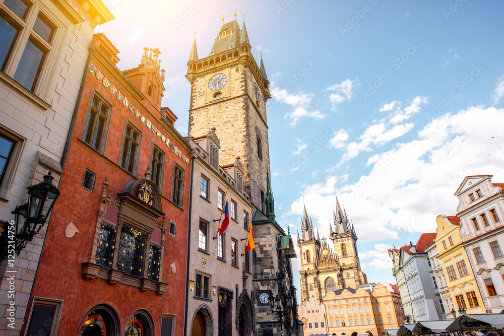 Cityscape view on the clock tower and Tyn cathedral in the old town of Prague
