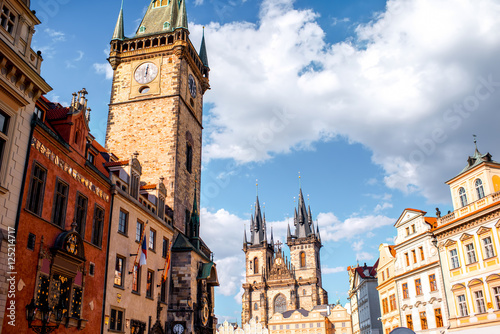 Cityscape view on the clock tower and Tyn cathedral in the old town of Prague