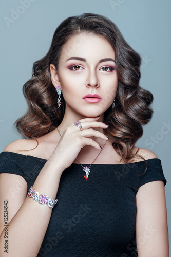 Elegant fashionable woman with jewelry. Beautiful woman with expensive pendant. Jewellery and accessories. Fashion and beauty salon. Perfect makeup.