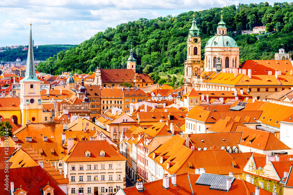 Fototapeta premium Cityscape top view on the lesser town with saint Nicholas cathedral in Prague