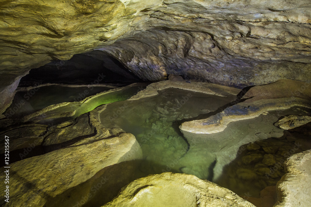 Natural speleothem, cascades of lakes and waterfalls in Nizhneshakuranskaya cave, Abkhazia, Georgia