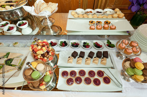 delicious dessert buffet with cookies, sandwiches and friuts