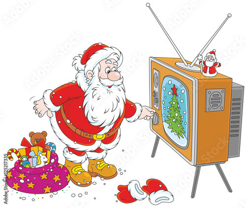 Santa Claus turning on his old wood TV set