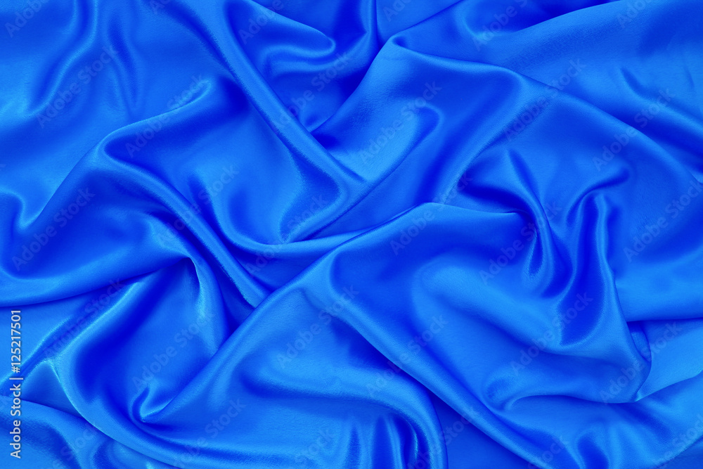 blue silk or blue satin textile fabric texture background blue silk or blue satin textile fabric texture background