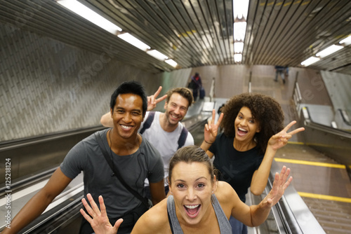 Canvas Print Group of friends having fun in subway stairs
