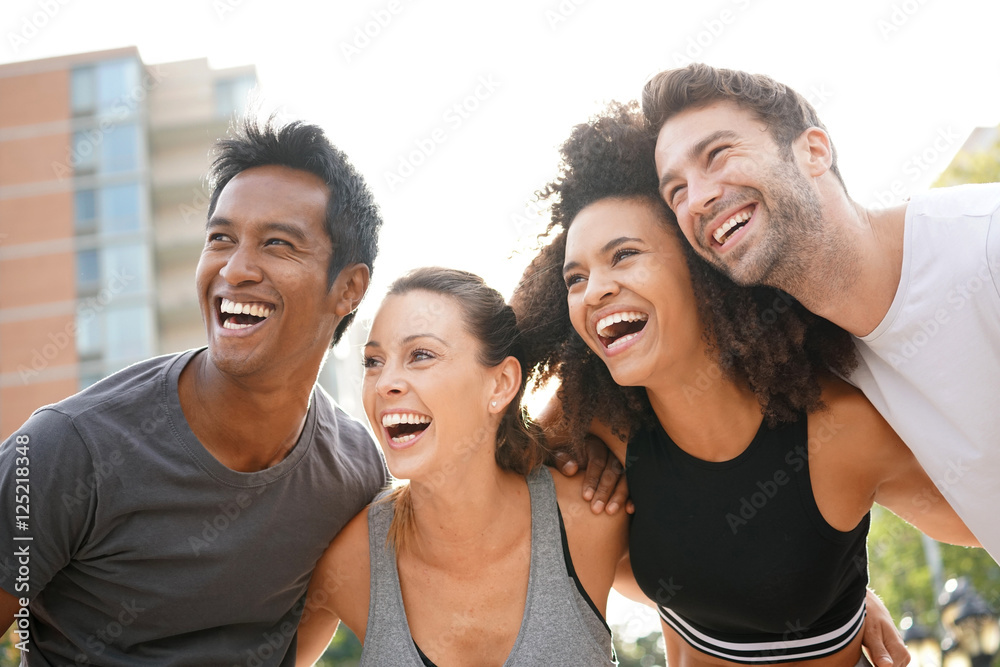 Obraz premium Group of atheltic people having fun together on running session