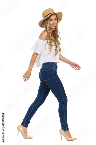 Walking Casual Woman In Straw Hat