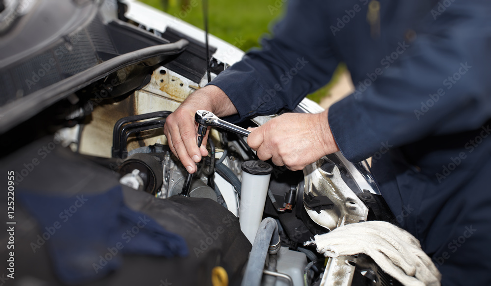 Car mechanic with wrench. Car mechanic with wrench.
