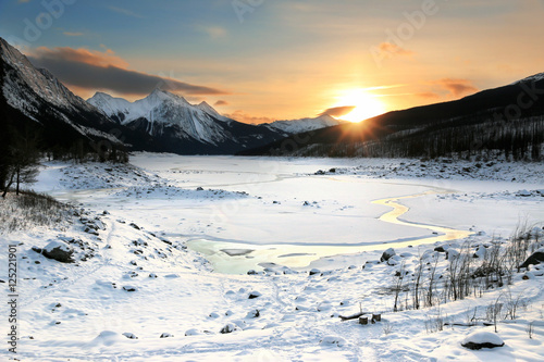 Colorful Sunrise in mountains. Winter Landscape, Rocky Mountains, Alberta, Canada