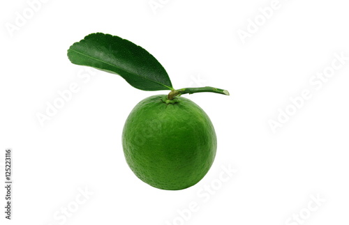 A green lemon with leaf on white screen