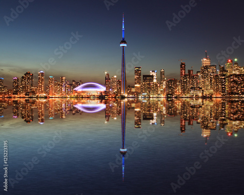 Photography Toronto Skyline at night with a reflection in Lake Ontario.