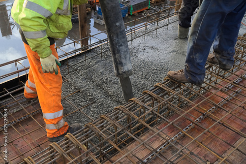 Concreting of slab pouring concrete engineering construction with rebar and formwork