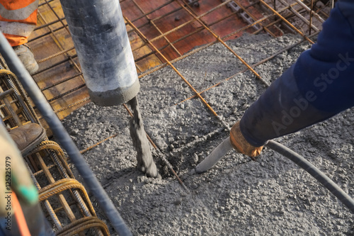 Concreting of slab pouring concrete engineering construction with rebar and formwork