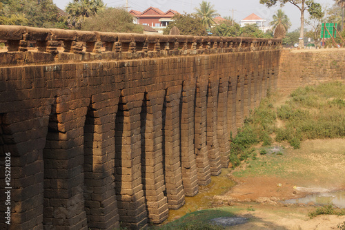 Sturdy corbeled arches of  Angkor bridge, photo