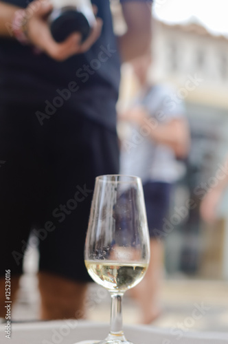 Albufeira, Portugal - August 03, 2016. Reastaurant waiter host presenting a wine bottle for tasting