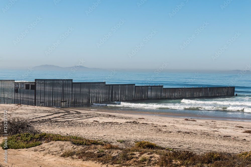 Border Field State Park beach with the international border fence between Tijuana, Mexico and San Diego, California, along with the Islas Los Coronados islands in the background. Border Field State Park beach with the international border fence between Tijuana, Mexico and San Diego, California, along with the Islas Los Coronados islands in the background.