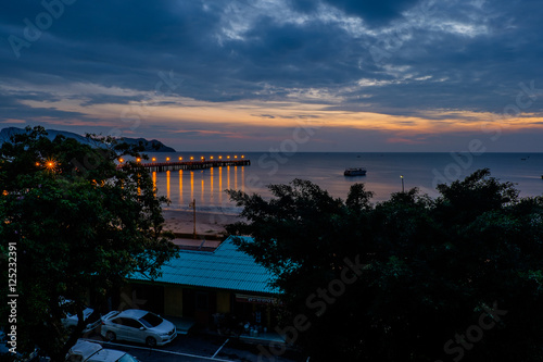 Beautiful illuminated shining in twilight at Prachuap port