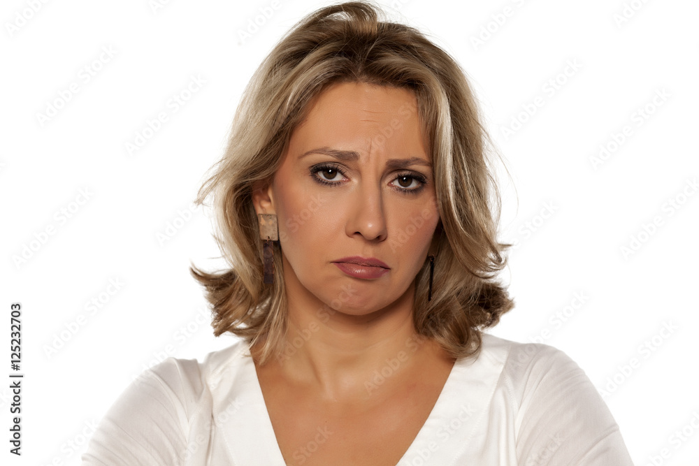 sad middle-aged woman on a white background sad middle-aged woman on a white background