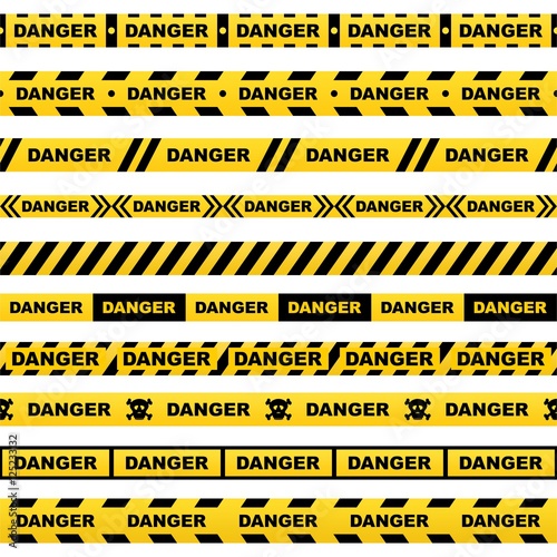 Set of yellow ribbons with black lettering danger skull and stripes indicating dangerous place on a white background. Safety police warning tapes