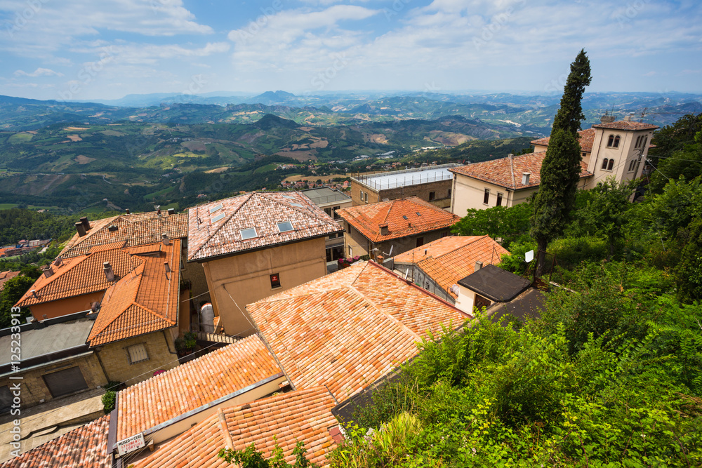 landscape with roofs of houses in small tuscan town in province,
