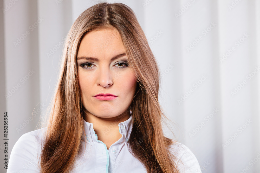 Angry and irritated business woman in office. Angry and irritated business woman in office.