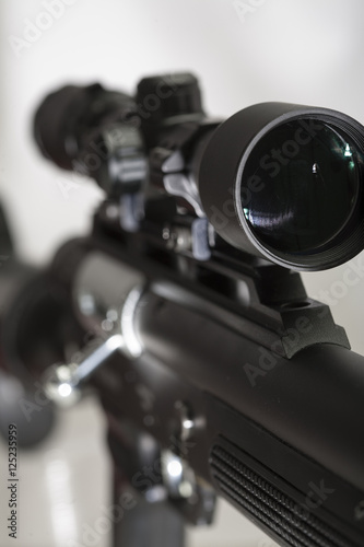 Sniper rifle scope close-up, zoomed, in focus