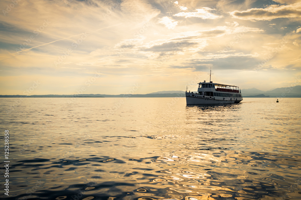 Ferry on Lake Garda at sunset. Ferry on Lake Garda at sunset.
