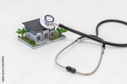 house building and stethoscope, home inspection concept photo