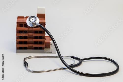 apartment building and stethoscope photo