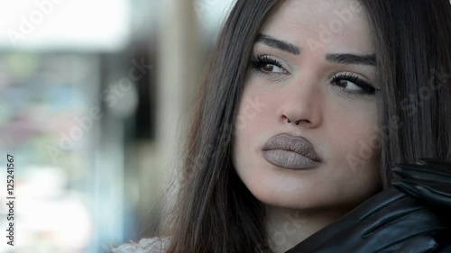 Woman with gloves and unique fleshy lips 