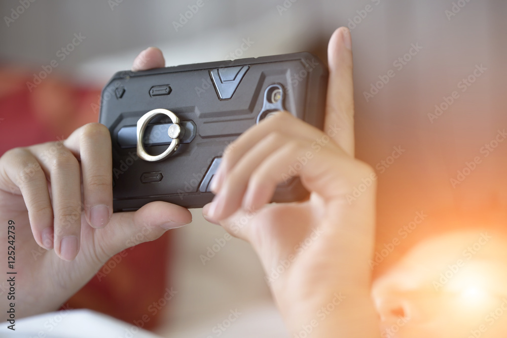 Smart phone in hand, boy .Concept the focus for the smart phone. For a long time is harmful to the eyes. Smart phone in hand, boy .Concept the focus for the smart phone. For a long time is harmful to the eyes.