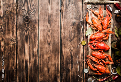 Photos oiled crawfish with beer bottles on the old Board.
