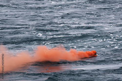 orange smoke on the water