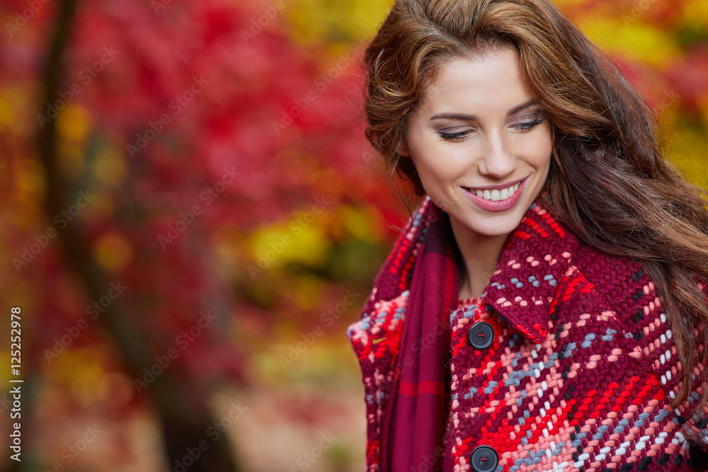 Fashion woman walking in autumn park Fashion woman walking in autumn park