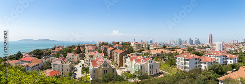 View of Old town and Qingdao bay from the hill of XiaoYuShan Park, Qingdao, China. 