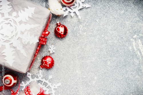 Christmas background with white red gift wrap and festive holiday decorations, top view, border photo