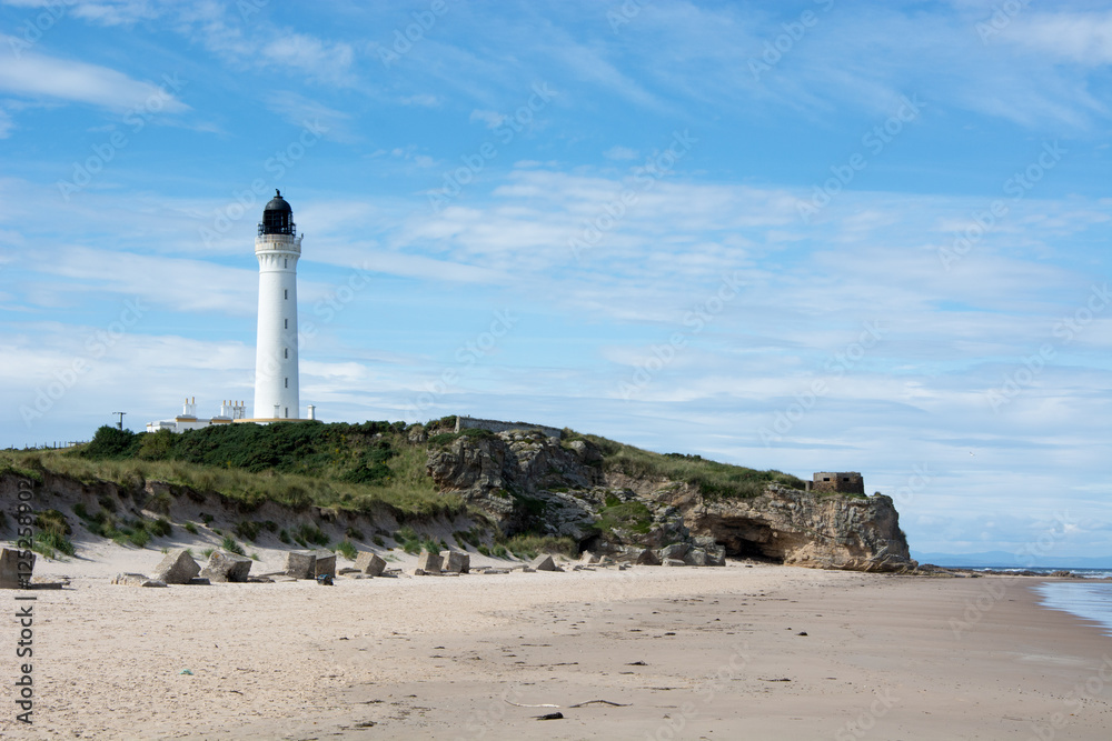 Coastal scene with beach and lighthouse
