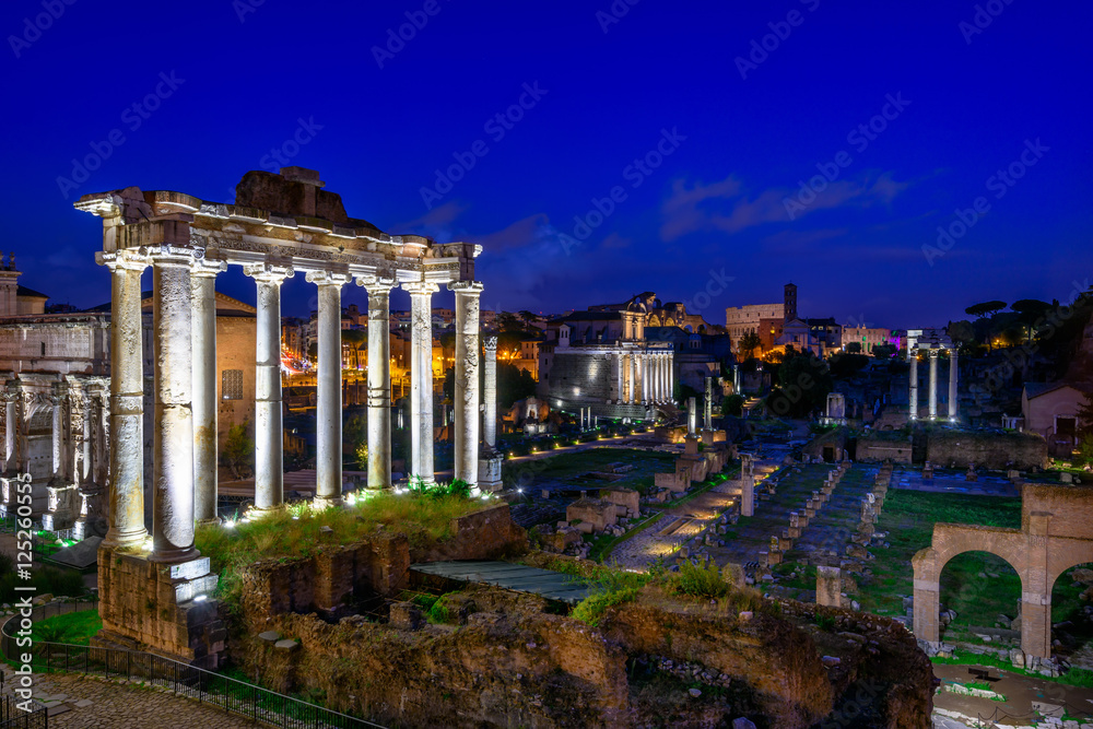 Night view of Temple of Saturn and Forum Romanum in Rome, Italy