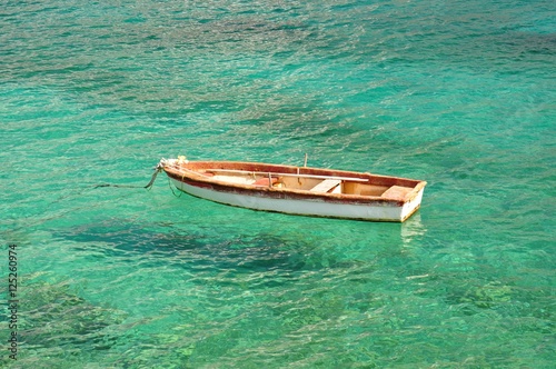A boat on  the turquoise waters of the Mediterranean Sea