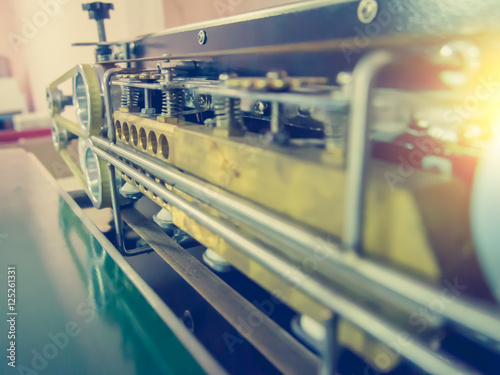close up automatic packaging machine with vintage filter
