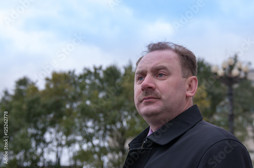 Portrait of a middle-aged man with a mustache  