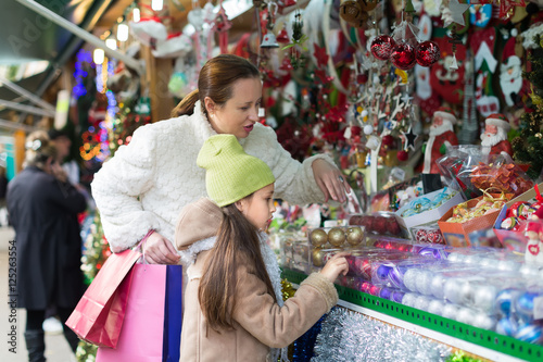 Mother with daughter in Christmas market