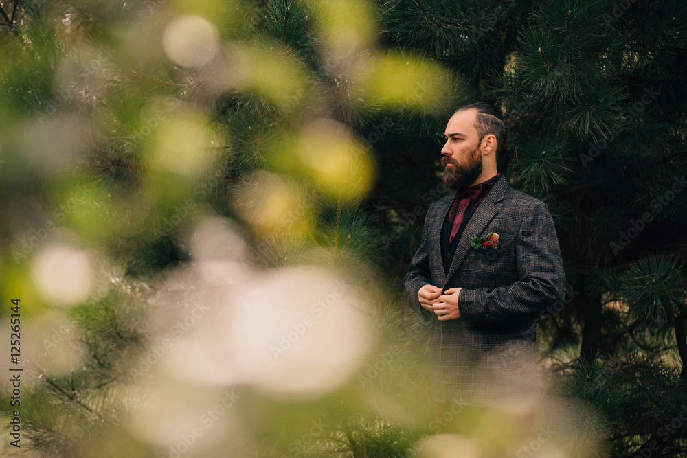 Portrait of a bearded groom after the wedding ceremony. Portrait of a bearded groom after the wedding ceremony.
