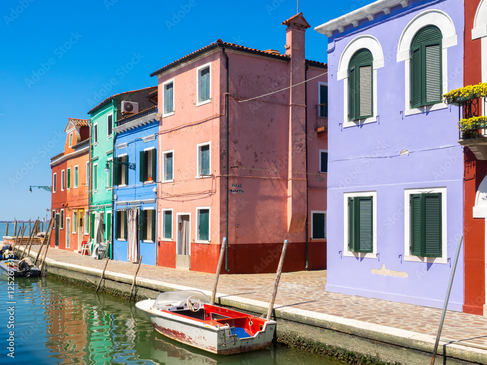 Colorful houses facade in Burano town, near Venice
