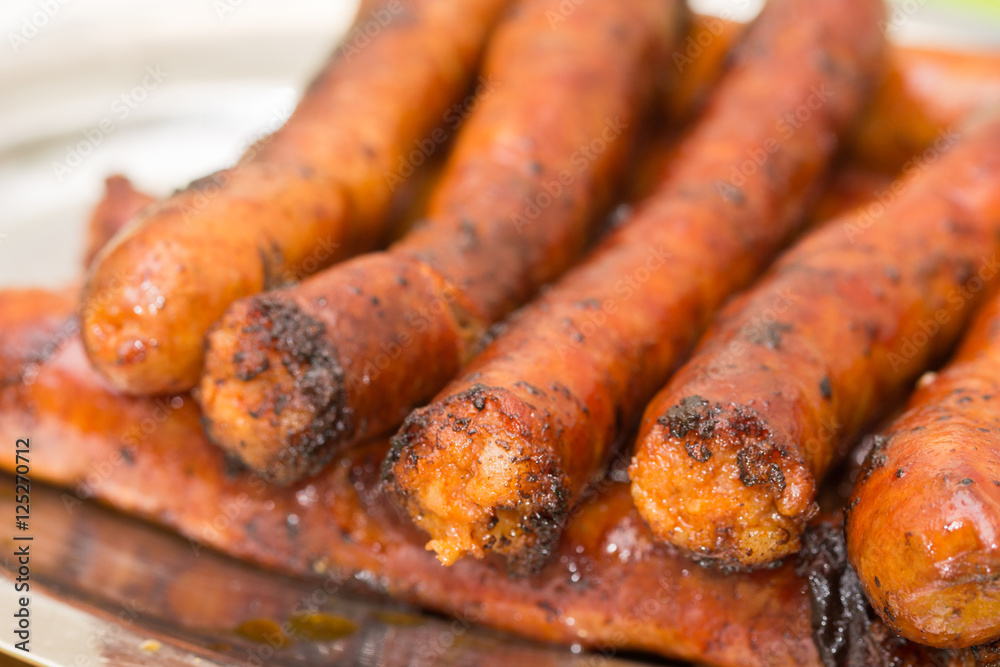 Served fried homemade red sausages Served fried homemade red sausages