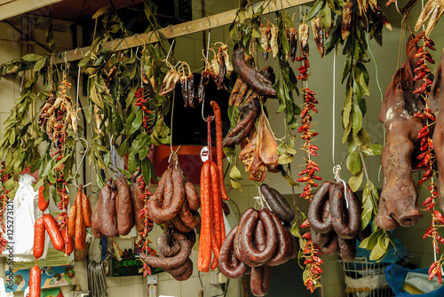 sausages stand inside the historical municipal market of the Bolhao in Oporto, Portugal