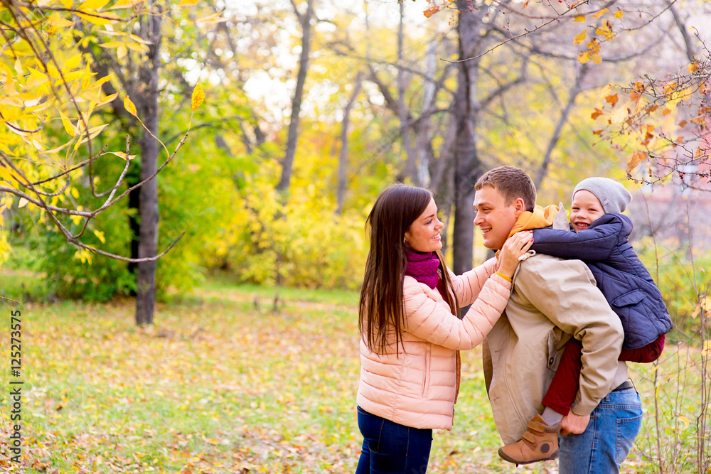 Mother and Father With Young Son Autumn Park