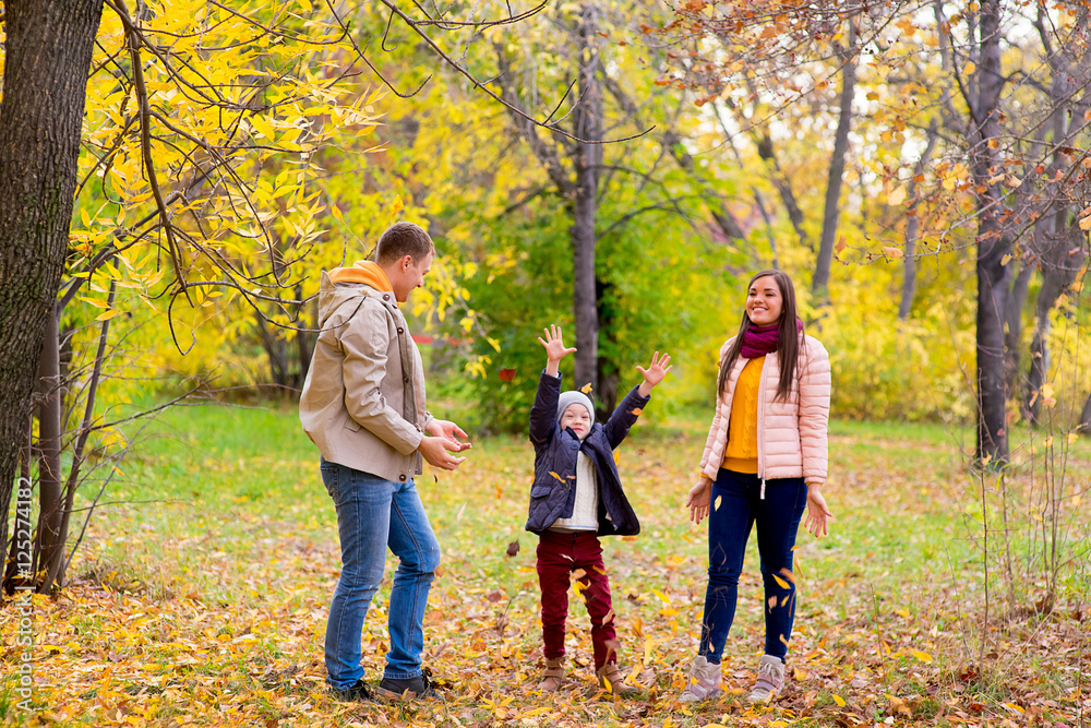 family playing with leaves autumn park family playing with leaves autumn park