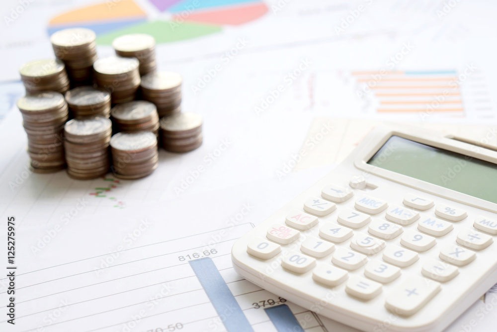 Coins, chart and calculator as a symbol for exchange rates. Coins, chart and calculator as a symbol for exchange rates.